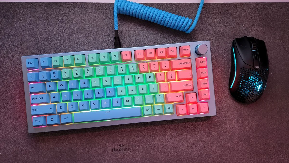 Gateron Oil King mechanical switches sitting on a desk pad.
